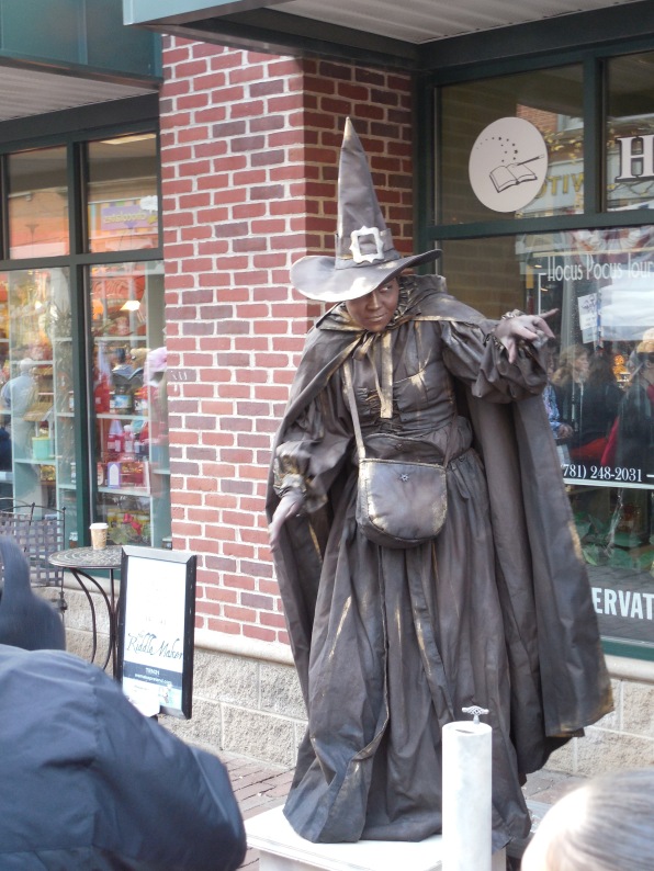 A busking witch in Salem